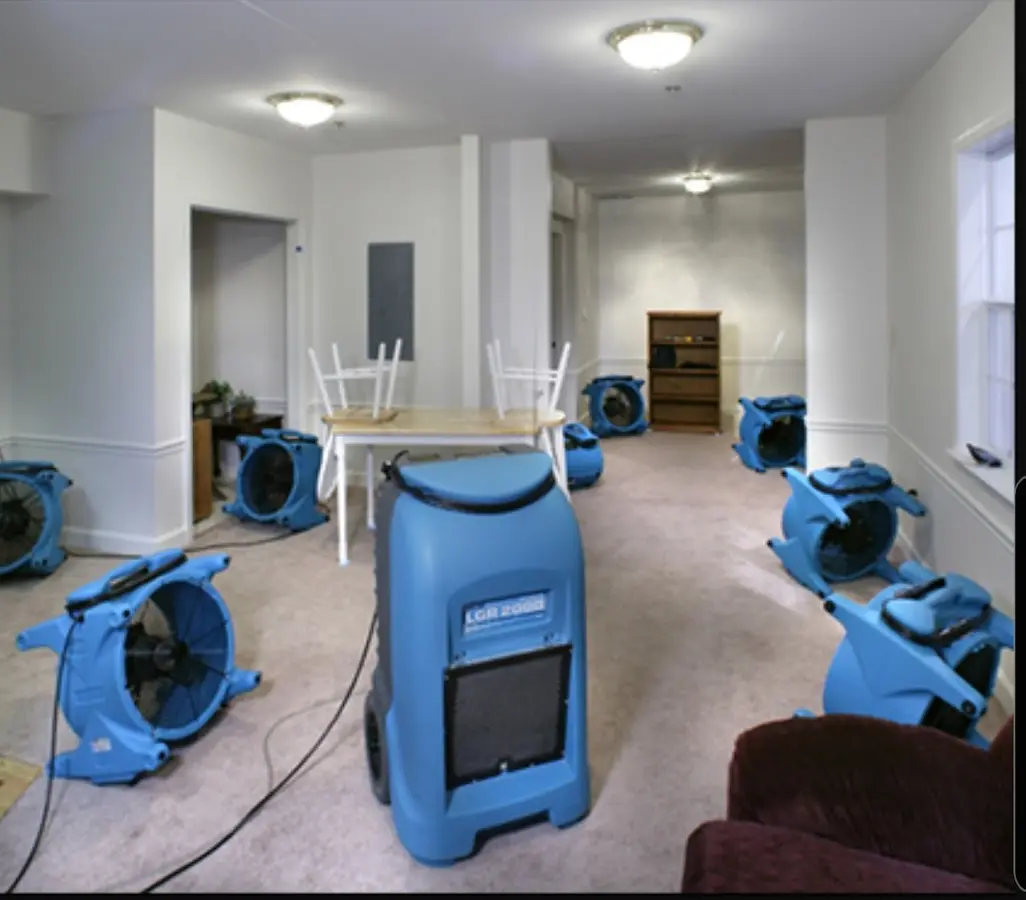 Air movers and dehumidifier setup for Water Damage Restoration in Bayonne